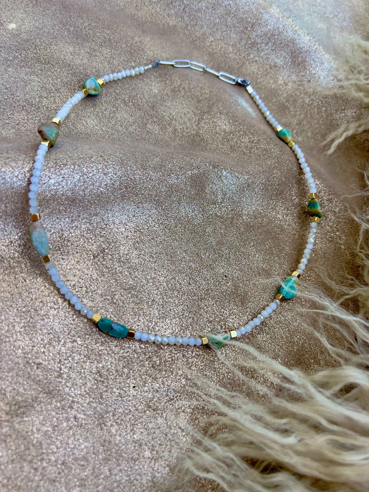 White, turquoise, and gold necklace